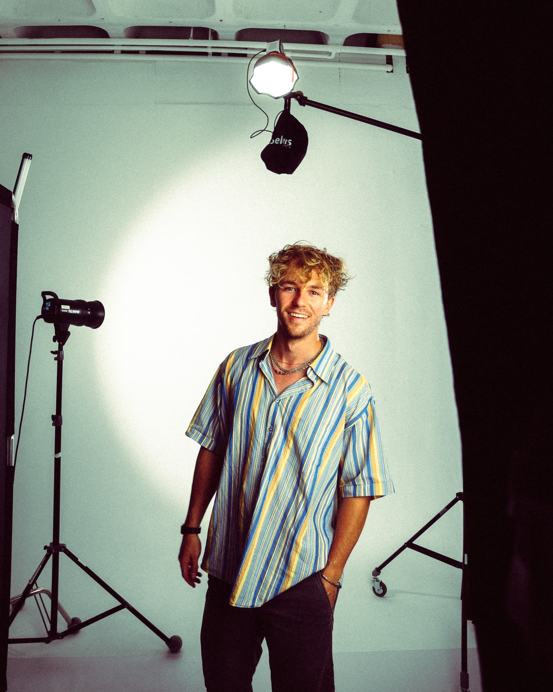 Portrait of filmmaker Devin Leick in a studio